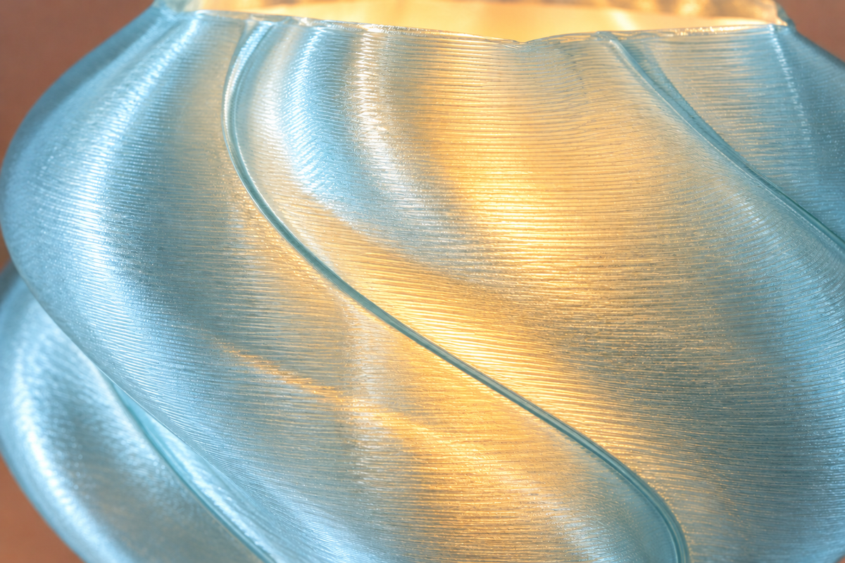 Extreme close-up of Elio’s translucent flowing geometry and fine printed layers