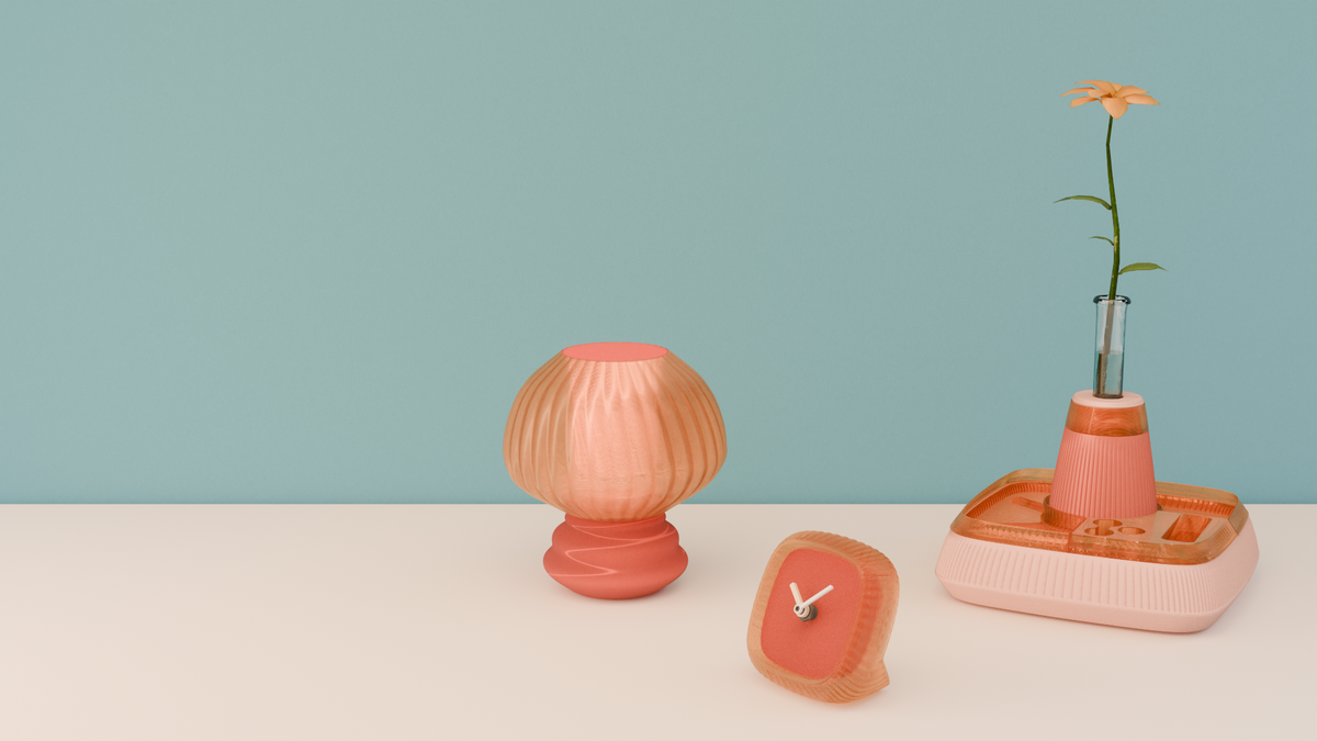 Coral lamp, clock and flower organizer on an ivory surface against a blue wall